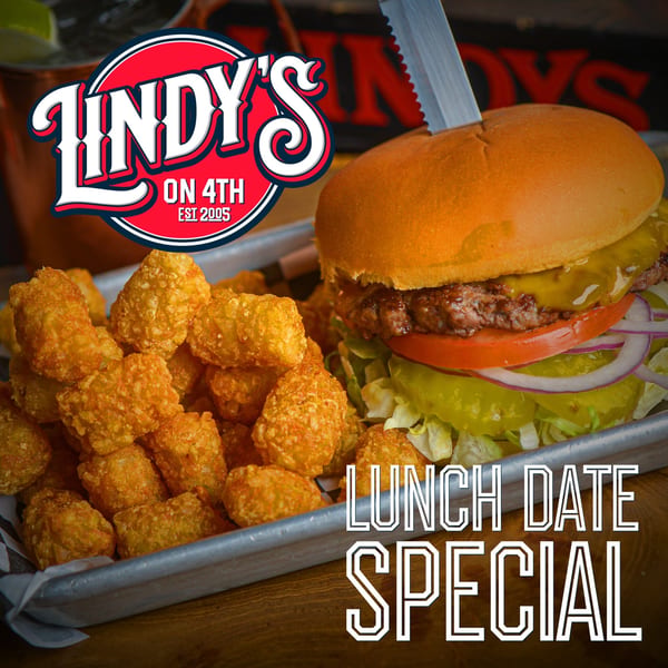 Lindy's on 4th burger with cheese, lettuce, tomato, onion, pickles, and tater tots.